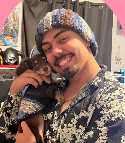 Caleb holding a small dog